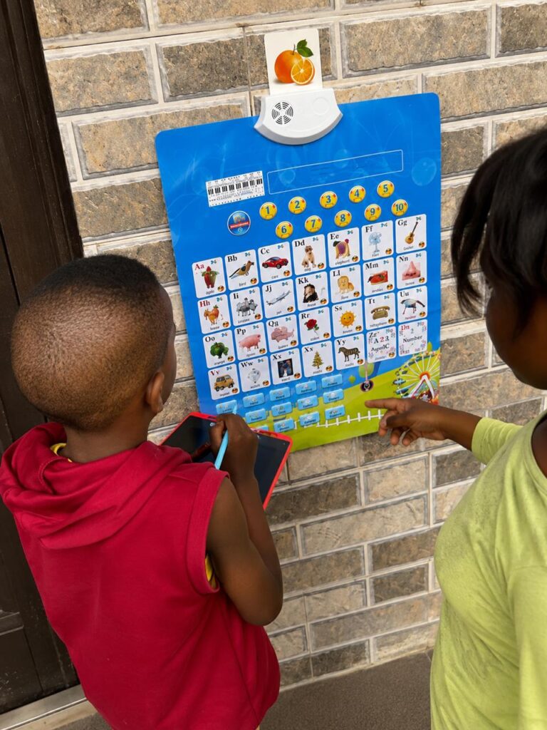 Boy using Epicckids Talking chart